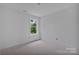 Unfinished bedroom with a window at 515 Harrel St, Salisbury, NC 28144