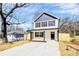 Charming two-story home featuring a modern design, new driveway, and a freshly installed wooden fence at 515 Harrel St, Salisbury, NC 28144