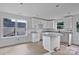 Unfinished kitchen with white cabinetry, granite countertops, and a stainless steel dishwasher at 515 Harrel St, Salisbury, NC 28144