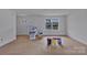 Spacious unfinished living room with natural light from the large window at 515 Harrel St, Salisbury, NC 28144