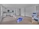 Unfinished open-concept area with access to the kitchen, featuring white walls and bright lighting at 515 Harrel St, Salisbury, NC 28144