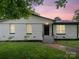 Charming single-story brick home with a well-manicured lawn and freshly painted exterior at 5316 Rupert Ln, Charlotte, NC 28215