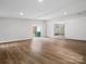 Spacious living room featuring wood floors, neutral walls, recessed lighting, and an entryway at 5316 Rupert Ln, Charlotte, NC 28215