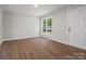 Bright, airy living room with new wood floors, fresh paint and natural light at 5316 Rupert Ln, Charlotte, NC 28215