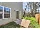 View of the backyard and patio space, accessible through a sliding glass door, perfect for outdoor relaxation at 5524 Howard St, Charlotte, NC 28269