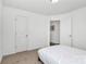 A bright bedroom features a large window, plush carpet, and a modern ceiling fan at 5524 Howard St, Charlotte, NC 28269