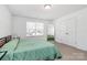 Comfortable bedroom with natural light, neutral decor, and a spacious closet for ample storage at 5524 Howard St, Charlotte, NC 28269