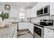 This spacious kitchen offers ample storage, subway tile backsplash, and modern stainless steel appliances at 5524 Howard St, Charlotte, NC 28269