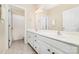 Bright bathroom with dual sink vanity, tile floors, and separate toilet/shower room at 615 Vega Nw St, Concord, NC 28027