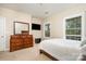 Bedroom with neutral carpeting, a dresser, a television, and a window at 615 Vega Nw St, Concord, NC 28027