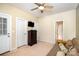 Bedroom featuring a ceiling fan, a dresser with a television, and a futon at 615 Vega Nw St, Concord, NC 28027