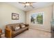 Comfortable bedroom featuring a cozy futon, neutral carpet, and a window view at 615 Vega Nw St, Concord, NC 28027
