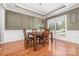 Formal dining room featuring wainscoting, a chandelier, and large windows at 615 Vega Nw St, Concord, NC 28027