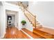 Open foyer with hardwood floors and a carpeted staircase at 615 Vega Nw St, Concord, NC 28027