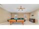 Spacious game room with pool table, ceiling fan, and comfortable seating arrangement at 615 Vega Nw St, Concord, NC 28027