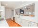 Open kitchen with white countertops that looks into an open dining and living area at 615 Vega Nw St, Concord, NC 28027