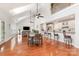 Open-concept living space featuring hardwood floors, high ceilings, and a seamlessly connected kitchen at 615 Vega Nw St, Concord, NC 28027