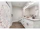 Elegant bathroom featuring a double vanity with granite countertop and modern fixtures at 619 N Skyland Dr, Mount Pleasant, NC 28124