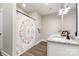 Bathroom featuring a shower with patterned curtain, a granite countertop and modern fixtures at 619 N Skyland Dr, Mount Pleasant, NC 28124