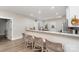 Spacious kitchen featuring a breakfast bar with seating, modern appliances, and bright lighting at 619 N Skyland Dr, Mount Pleasant, NC 28124