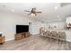 Open living space with luxury vinyl flooring, a ceiling fan, and views of the kitchen at 619 N Skyland Dr, Mount Pleasant, NC 28124