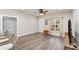 Open-concept living room with neutral walls, luxury vinyl flooring, and natural light at 619 N Skyland Dr, Mount Pleasant, NC 28124