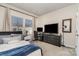 Comfortable bedroom featuring a large window with blinds, a work station, and stylish decor at 6419 Cambridge Dr, Harrisburg, NC 28075