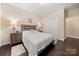 Relaxing bedroom with hardwood floors, soft lamps, and a simple decor at 7909 Parknoll Dr, Huntersville, NC 28078