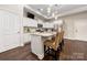 Modern kitchen features a center island with bar seating and stainless steel appliances at 7909 Parknoll Dr, Huntersville, NC 28078