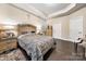 This main bedroom features hardwood floors, and a tray ceiling at 7909 Parknoll Dr, Huntersville, NC 28078