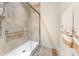 The modern bathroom has a tile shower with glass doors and decorative towels at 7909 Parknoll Dr, Huntersville, NC 28078