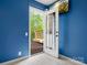 Bright bedroom with a door to balcony, carpeted floors, and a mounted television for relaxation at 9009 Stourbridge Dr, Huntersville, NC 28078