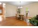 Dining room with hardwood floors, elegant chandelier and stylish dining set at 9009 Stourbridge Dr, Huntersville, NC 28078
