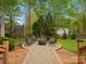 Backyard fire pit area with comfortable seating, perfect for outdoor entertaining at 9009 Stourbridge Dr, Huntersville, NC 28078