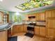 Modern kitchen featuring granite countertops, stainless steel appliances, and custom cabinetry at 9009 Stourbridge Dr, Huntersville, NC 28078