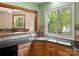 Eat-in kitchen bar area with granite countertops and ample natural light at 9009 Stourbridge Dr, Huntersville, NC 28078