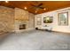 Inviting living room featuring a stone fireplace, wood ceiling, and natural light at 9009 Stourbridge Dr, Huntersville, NC 28078