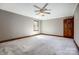 Spacious bedroom features a ceiling fan, a window, and ample space, ideal for relaxation and comfort at 9951 Providence Forest Ln, Charlotte, NC 28270