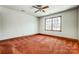 Spacious bedroom with a large window, ceiling fan and ample natural light at 9951 Providence Forest Ln, Charlotte, NC 28270