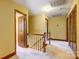 Bright upstairs hallway offers seamless access to all rooms, ensuring a smooth flow throughout the home at 9951 Providence Forest Ln, Charlotte, NC 28270