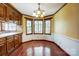 Traditional kitchen with wood cabinets, hardwood floors, and lots of natural light at 9951 Providence Forest Ln, Charlotte, NC 28270