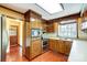 Charming kitchen featuring wood cabinets, hardwood floors, and stainless steel appliances at 9951 Providence Forest Ln, Charlotte, NC 28270