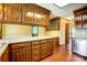 Kitchen with ample counter space, wood cabinets, and hardwood floors at 9951 Providence Forest Ln, Charlotte, NC 28270