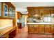 Traditional kitchen boasting wood cabinets, hardwood floors and stainless steel appliances at 9951 Providence Forest Ln, Charlotte, NC 28270