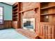 Living room with a brick fireplace and built-in shelving for a cozy atmosphere at 9951 Providence Forest Ln, Charlotte, NC 28270