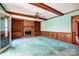 Comfortable living room with exposed beam ceiling, fireplace with built-ins and beadboard accents at 9951 Providence Forest Ln, Charlotte, NC 28270