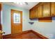 Convenient mud room with cabinetry, storage, and easy access to the outdoors at 9951 Providence Forest Ln, Charlotte, NC 28270