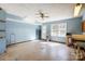 Spacious, light-filled room with a ceiling fan, utility sink and a door to the backyard at 9951 Providence Forest Ln, Charlotte, NC 28270