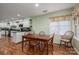 Bright dining area with a wood table, chairs, and a view to the adjacent kitchen at 108 N Oakwood Dr, Kings Mountain, NC 28086