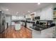 Spacious kitchen with white cabinets, black countertops, and a center island at 108 N Oakwood Dr, Kings Mountain, NC 28086